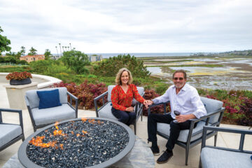 Philly and Ron Montbleau gather around the fire bowl they designed as a gathering space for after-dinner conversation. The fire bowl is crafted of Fusion quartzite from Arizona Tile and fabricated by American Marble. Arizona Tile was also used in the hardscape by Geoff Herbert