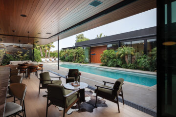 The U-shaped house was designed for privacy with two wings hugging an interior courtyard and poo