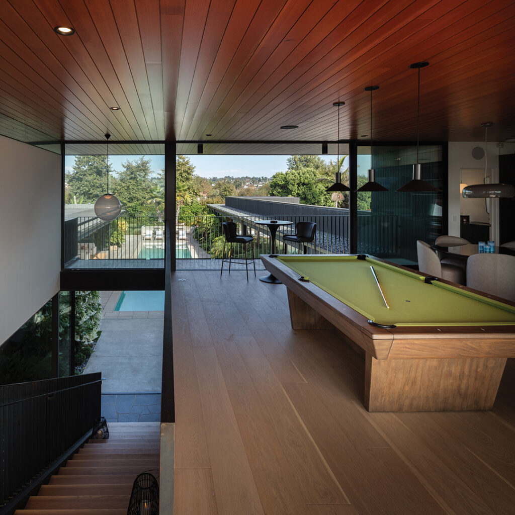 The second-story game room boasts pool and ocean views