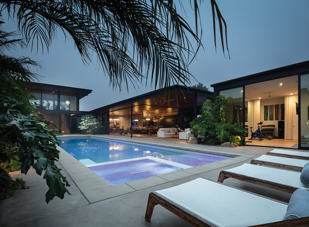 The U-shaped house creates intrigue and distinctive zones for work, play, and a sense of calm