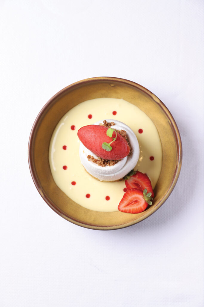 Vanilla Bean Cheesecake, Lemon Almond Sponge Cake, Graham Cracker Crumble, Strawberry Sorbet