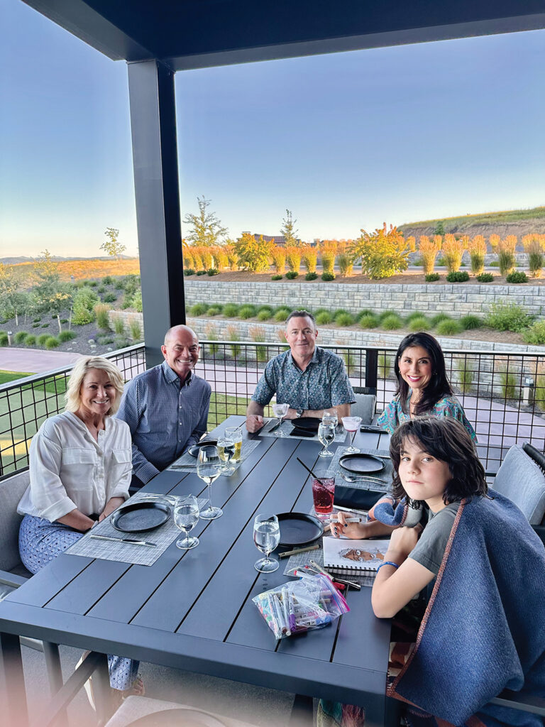Dining al fresco at The Clubhouse with Gayle and John Cochrane (left)