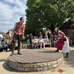 Young thespians reenacting scenes from Much Ado About Nothing on the patio of William Shakespeare’s birthplace