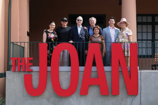 Philanthropist Irwin Jacobs, surrounded by family members, at the ribbon cutting ceremony for the Joan and Irwin Jacobs Performing Arts Center, nicknamed “The Joan”