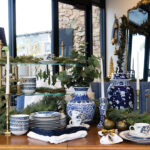 The Beaudry mirror reflects the scene above the Zarah console table in whitewashed oak