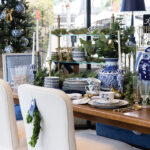 This festive dining room display features the Casa Florentina Trevine double pedestal extension dining table and Betsy dining chairs