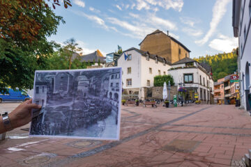 In Clervaux, a local guide shows visitors a World War II-era photo of the town square
