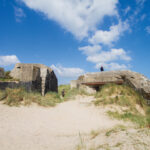 Utah Beach is one of two American landing beaches in France on D-Day that allowed for the invasion forces to advance off the beach and through the flooded fields