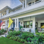 The family enjoys playing games on the home’s front porch