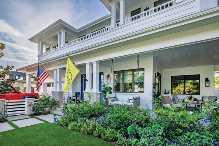 The family enjoys playing games on the home’s front porch
