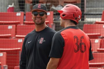 Aztecs Head Baseball Coach Kevin Vance with player Zach Justice
