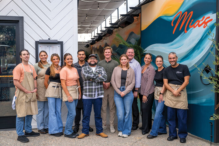 Mia’s management team (back row, center, L-R) Henry Staunton, Scott Buchan, and Annia Bonifaz, with staff