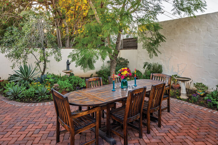 The couple spend much of their time on the expansive brick patio, centered with a fireplace for relaxing and entertaining