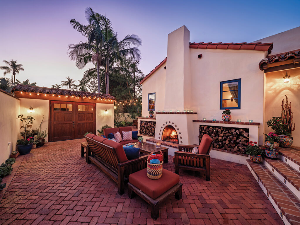 The couple spend much of their time on the expansive brick patio, centered with a fireplace for relaxing and entertaining