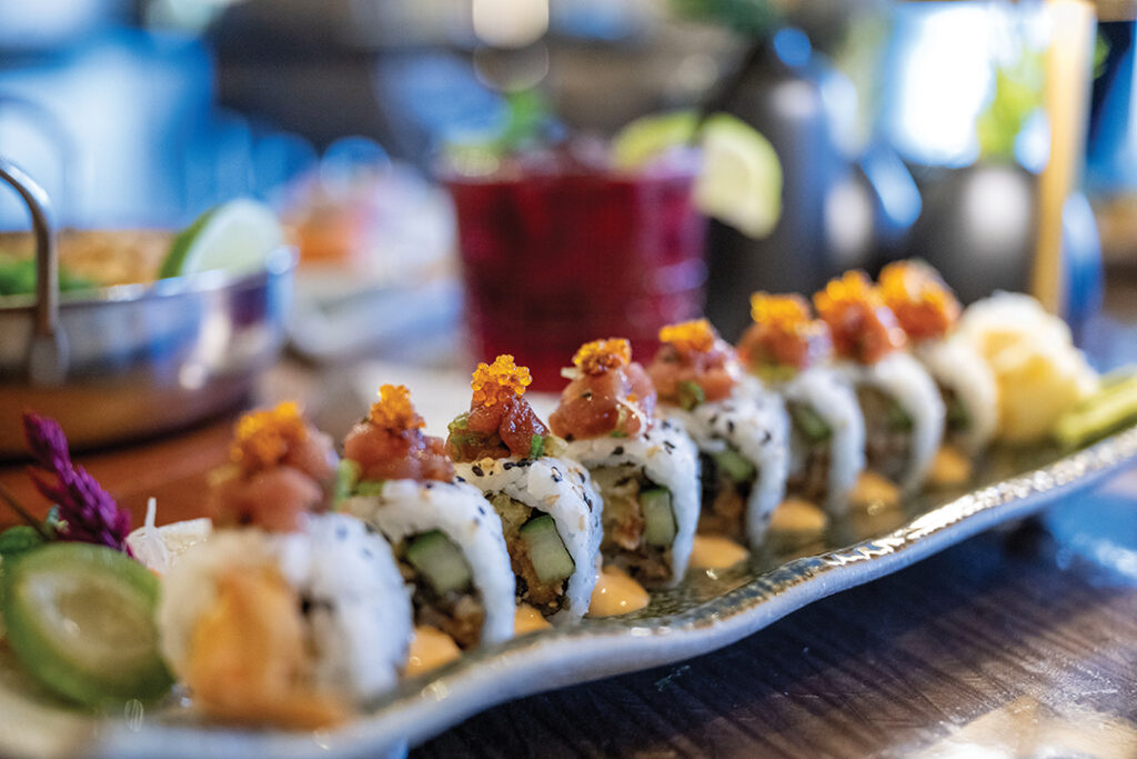 The Roppongi Roll features tempura shrimp, unagi, cucumber, spicy toro, and tobiko
