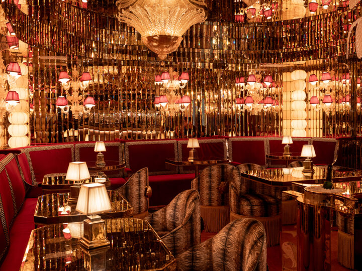 Fallen Empire, a hidden oyster and champagne bar, is tucked discreetly behind the lobby. The reservation-only jewel box bar features mirrored walls, red mohair upholstered booths with built-in champagne buckets, and an ornate mosaic floor depicting under-the-sea scenery. The double-duty bar — both cocktails and raw seafood — is heaped with decadent displays of Kumamoto oysters, scallop crudo, and uni tartare. The Champagne menu is an effervescent homage, featuring leaning rare vintages and cocktails