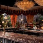 It’s the blue lagoon reimagined as Night Hawk, an open-fire Greek restaurant. Rock-formed booths and banquettes create nooks from which to review the overwrought design