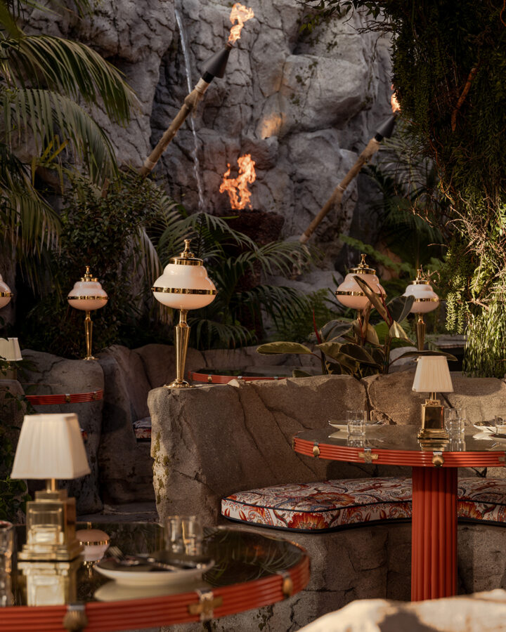 It’s the blue lagoon reimagined as Night Hawk, an open-fire Greek restaurant. Rock-formed booths and banquettes create nooks from which to review the overwrought design