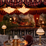 It’s the blue lagoon reimagined as Night Hawk, an open-fire Greek restaurant. Rock-formed booths and banquettes create nooks from which to review the overwrought design