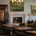 Soft, neutral tones, natural textures, and abundant light create a relaxed yet sophisticated setting