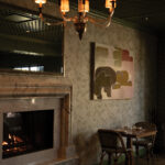 Soft, neutral tones, natural textures, and abundant light create a relaxed yet sophisticated setting