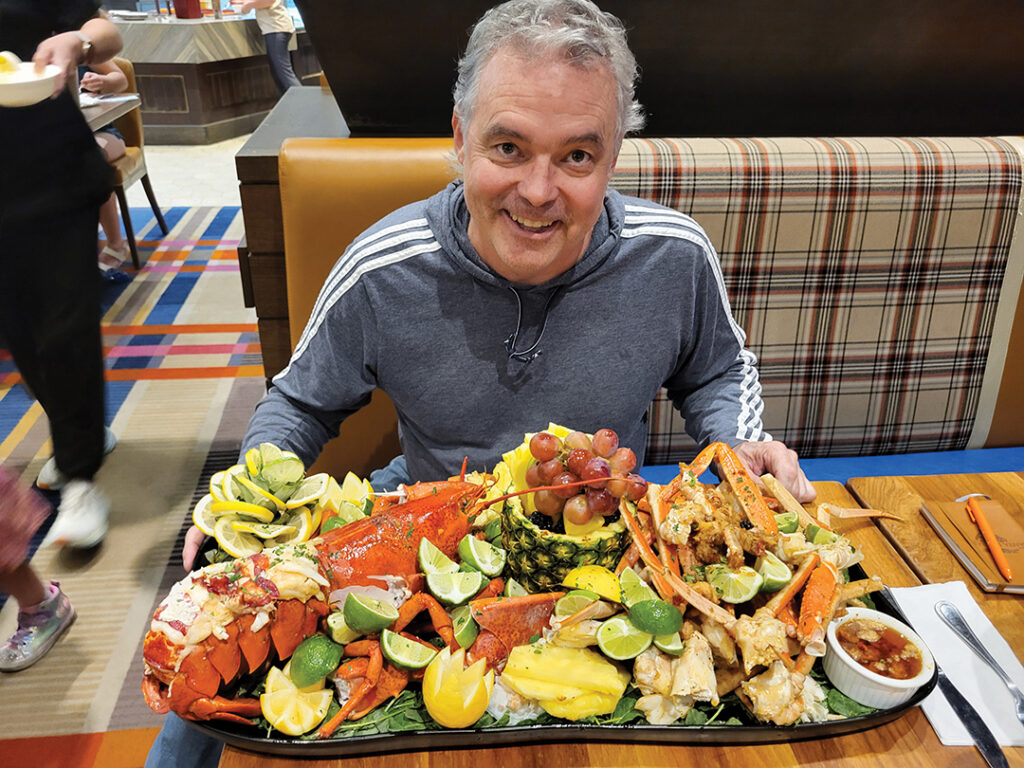 Ron Donoho enjoying a five-pound lobster at A.Y.C.E.