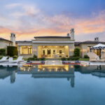Privately tucked behind gates on nearly five acres on the coveted west side of the Covenant, 16640 El Camino Real pairs modern design with panoramic southwest views and is listed for $14,850,000