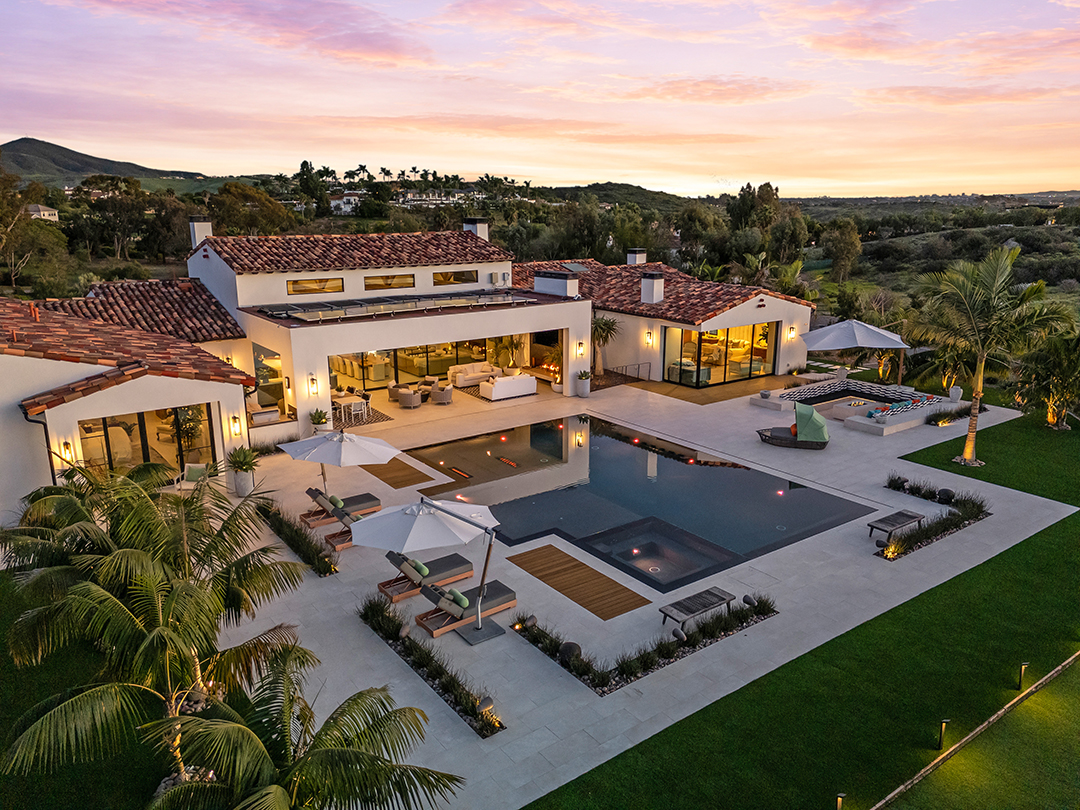 Set on a 2.62-acre lot, this 7,014-square-foot estate on 16786-88 Calle Hermosa in Rancho Santa Fe features 6 bedrooms, 8 bathrooms, a 5-car garage, and a 2-bedroom guest house. It is listed for $9,850,000