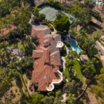 The house features a pool, a cedar-lined dry sauna, Breathe Degrees cold plunge with 36-degree chiller, and redwood enclosed surf shower; listed for $5,500,000, 18044 Loma Alegre in Rancho Santa Fe features equestrian facilities, tennis court, organic garden, a chicken coop, and a private well