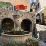 The hilltop village of St. Paul de Vence is picturesque, with narrow cobblestone streets and stone buildings filled with galleries, shops, and bistros