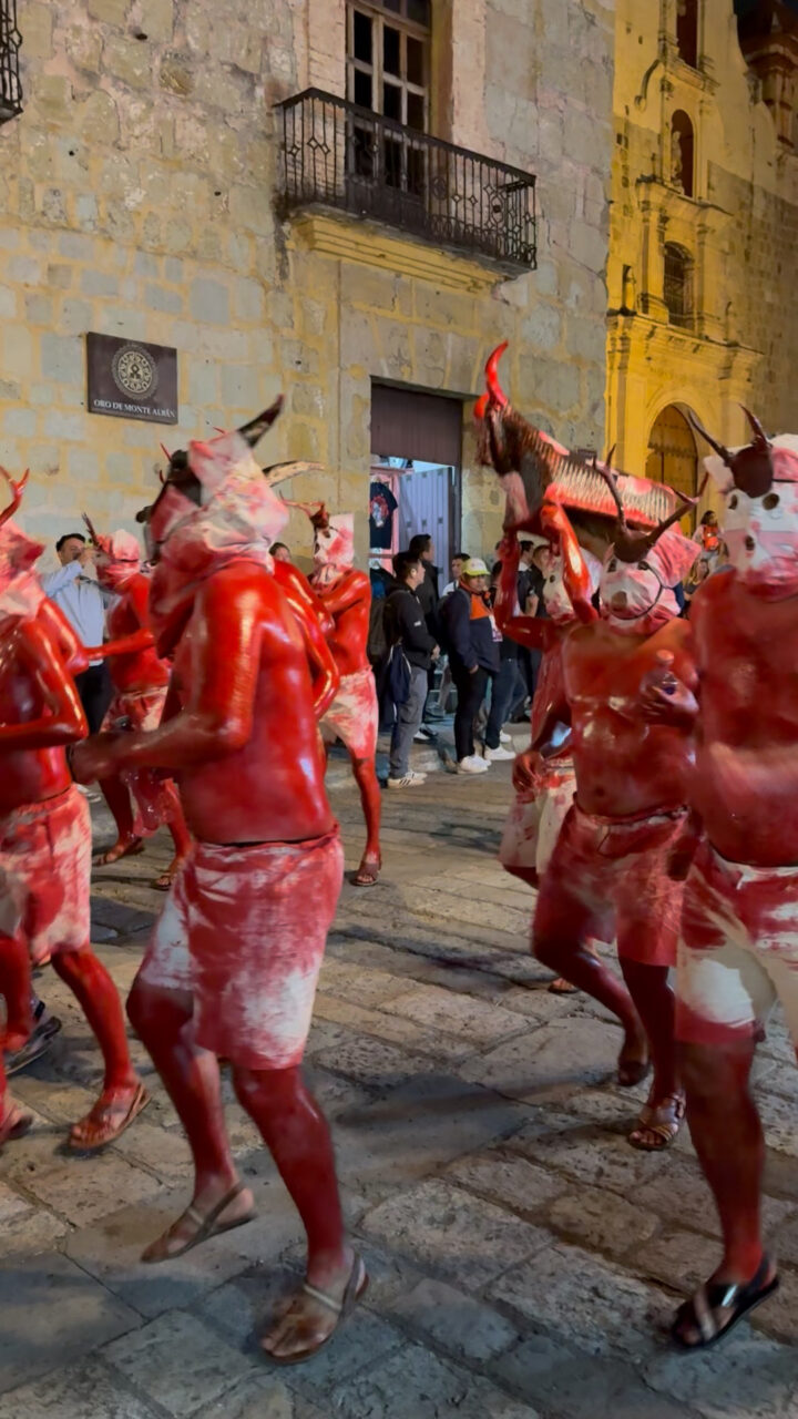 Diablos, or devils, make their way through the streets of Oaxaca while chanting and beating drums