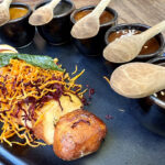 A sampler of five different versions of mole are served with roasted chicken for a delicious feast