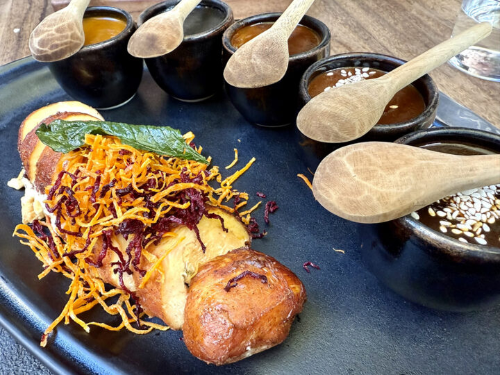 A sampler of five different versions of mole are served with roasted chicken for a delicious feast