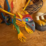 A bird-like creature resembling a parrot is one example of how alebrijes bring elements of nature to this art