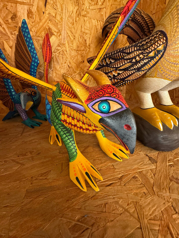 A bird-like creature resembling a parrot is one example of how alebrijes bring elements of nature to this art