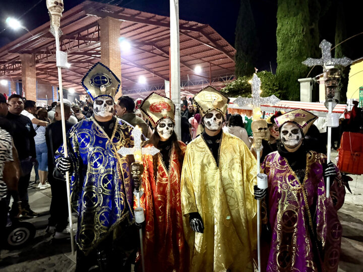 A ghostly procession makes its way through the crowds at the Battle of the Bands