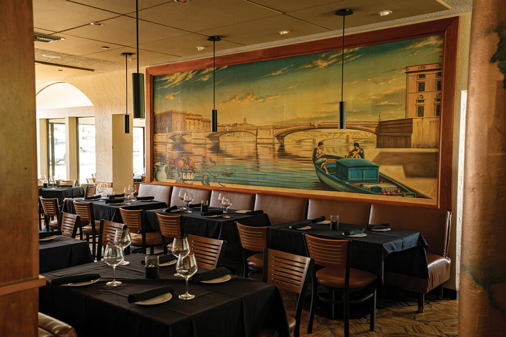 Rich wood, warm lighting, and Italian-inspired details lend Firenze Trattoria a cozy, romantic Tuscan ambiance