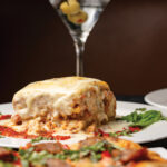 Lasagne Firenze: layered with ricotta cheese, beef, chicken, sausage, roma tomato, mushroom, and parmigiano-reggiano, with marinara sauce and creamy bechamel