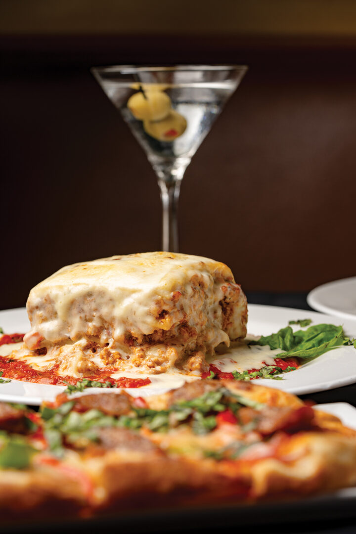 Lasagne Firenze: layered with ricotta cheese, beef, chicken, sausage, roma tomato, mushroom, and parmigiano-reggiano, with marinara sauce and creamy bechamel