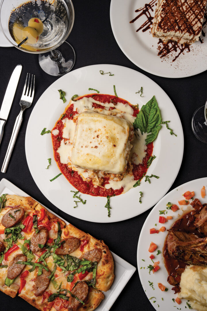 Lasagne Firenze: layered with ricotta cheese, beef, chicken, sausage, roma tomato, mushroom, and parmigiano-reggiano, with marinara sauce and creamy bechamel