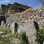 The ancient ruins at Monte Albán include sacred headstones dating back thousands of years that portray the persons buried beneath